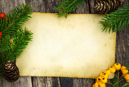 Christmas theme with blank paper on wooden planksの写真素材
