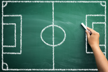 empty soccer field on blackboard, handwriting with chalk for tacticの写真素材