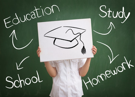 school child front blackboard education conceptの写真素材