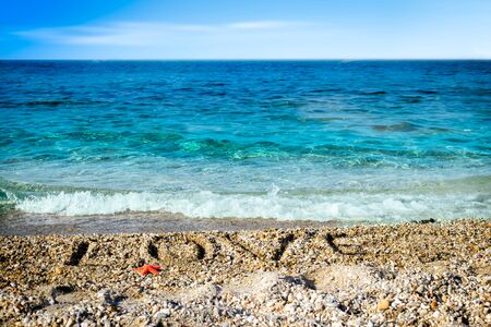 Word love in the sand at the beach on Valentine Day.の写真素材
