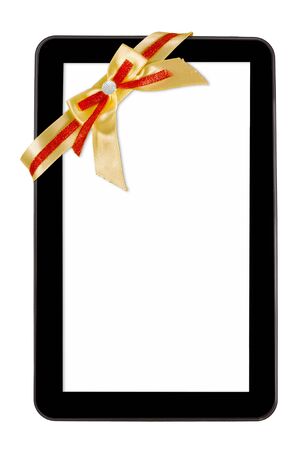 Tablet pc with festive bow isolated over white backgroundの写真素材