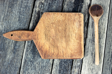 Cooking background - wooden spoon and  cutting boardの写真素材