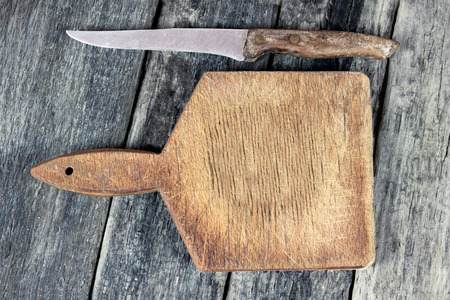 Knife on rustic kitchen table with copy spaceの写真素材