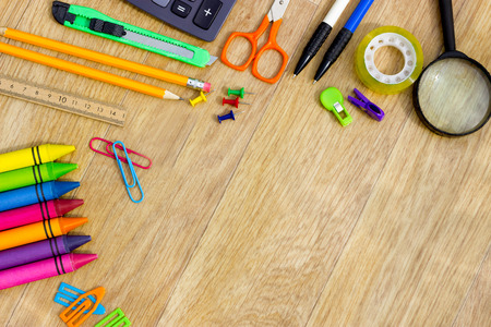 Assortment of various school items on wooden backgroundの写真素材