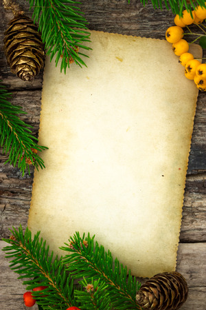 Festive frame with vintage paper and Christmas decorationの写真素材