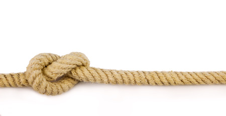 Close-up of rope with knot isolated on whiteの写真素材