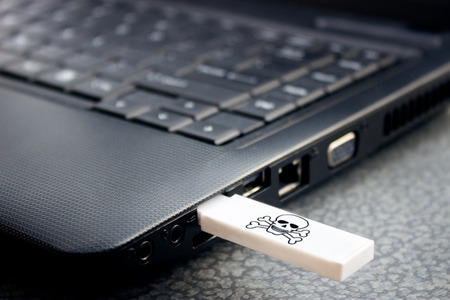infecting a portable computer with a virus via USBの写真素材