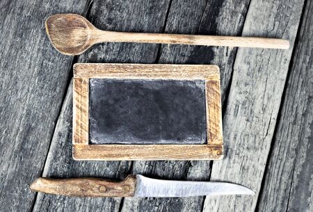 Blank menu blackboard over vintage wooden backgroundの写真素材