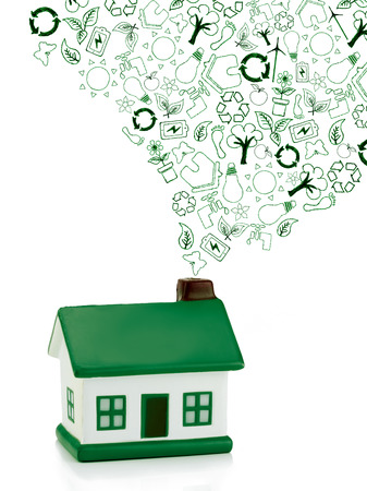 green house with eco icons out of  chimney,  not polluting the environment, concept  eco chimneyの写真素材
