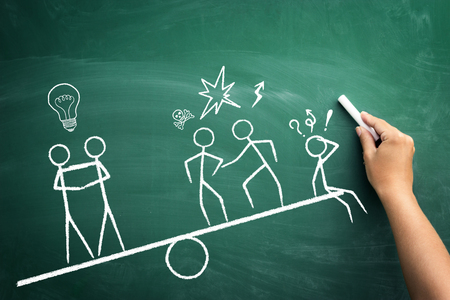 Teamwork wins, business sketch on green blackboardの写真素材