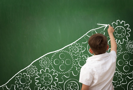 clever child draws your own success, sketch metaphor of the gear system on blackboardの写真素材