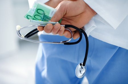Corrupt and unethical doctor with stethoscopeの写真素材