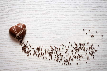 Heart shaped chocolate on white backgroundの写真素材