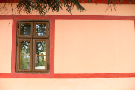 Old frame window on painted wallの写真素材