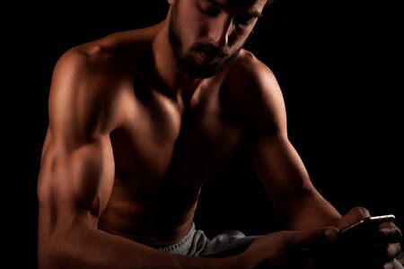 Fitness male model showing triceps muscleの写真素材