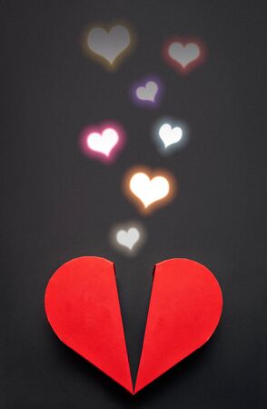 Red heart box with colorful glowing heart coming from it, Valentines Day conceptの写真素材