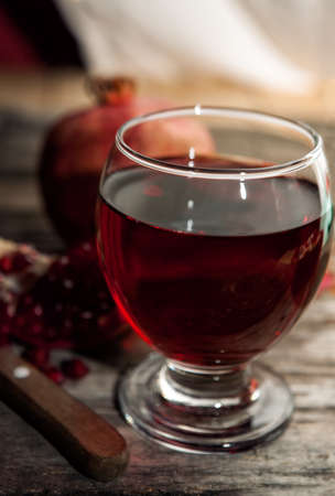 Glass of delicious and fresh red pomegranate juiceの写真素材