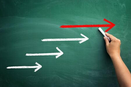 Strong team leadership ? team leadership concept design with red and white arrowsの写真素材