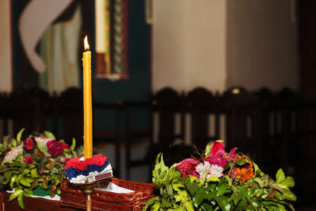 Wedding flowers and candle in churchの写真素材