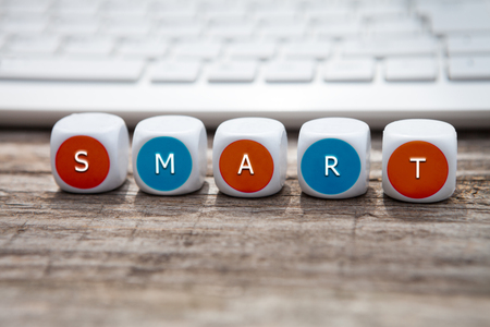 Letter dice with smart text and keyboard in the backgroundの写真素材