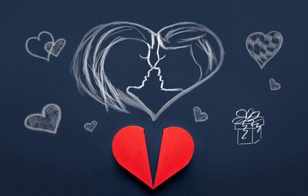 Couple in heart drawing with little hearts and present above red heart box, Valentines Day conceptの写真素材