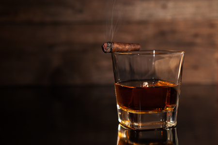 Cigar and glass with whiskeyの写真素材