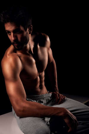 Handsome muscular male model posing