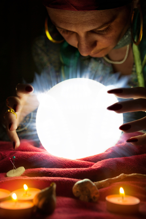 Crystal ball for fortune telling and hands of gypsy fortune tellの写真素材