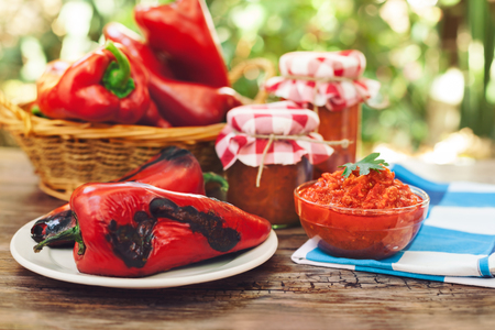Served traditional Ajvar with roasted peppers on tableの写真素材