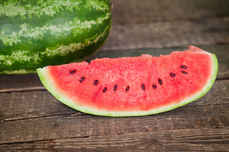  Slice of fresh watermelon on wooden tableの写真素材