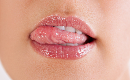 Close up of mouth, sexy licking hot lipsの写真素材