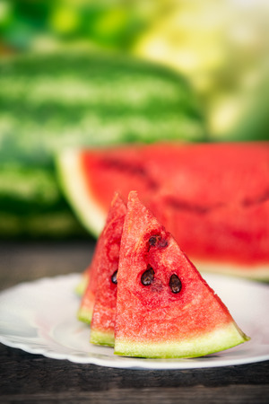 Fresh slice of watermelon slice on white plateの写真素材
