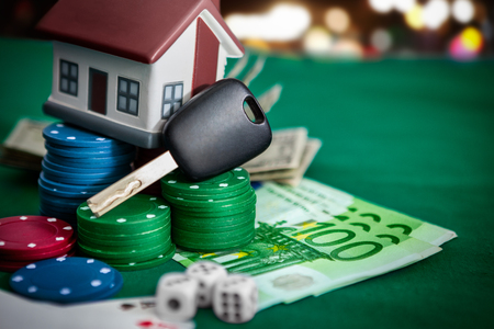 House and car keys on card chips. Poker game with high stake on the table.の写真素材