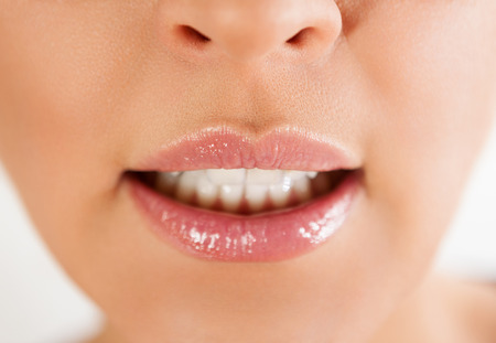 Perfect natural lip makeup. Bbeautiful female mouth with plump full lips.Perfect clean skin, light fresh lip make-up. Beautiful spa tender lipの写真素材