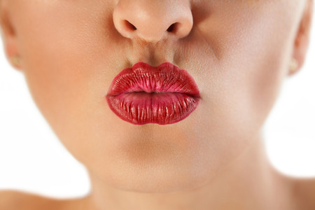 Sexy gorgeous red lips pucker up for kissの写真素材