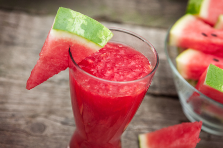 Fresh watermelon cocktail in glass with watermelon pieceの写真素材