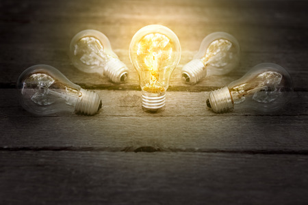 Concept of business idea presented with glowing bulbの写真素材