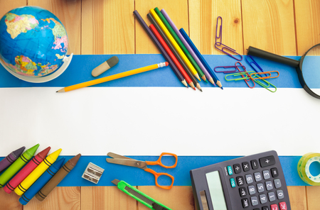 School supplies on wooden background,flat lay,empty space for textの写真素材