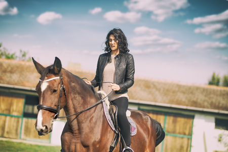 Beautiful woman rider, enjoying in sport and hobbyの写真素材