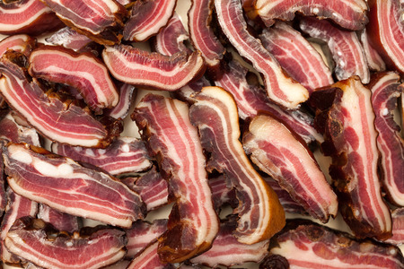 Rashers of bacon on plateの写真素材