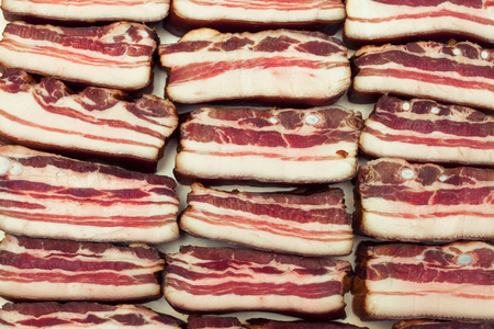 raw bacon, fresh slice backgroundの写真素材