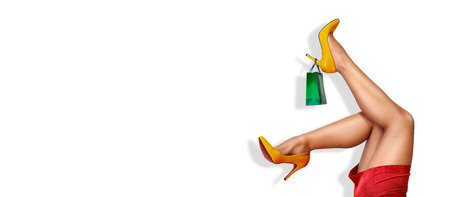 Sexy woman in high heels with shopping bag, holyday shopping season, shopping backgroundの写真素材
