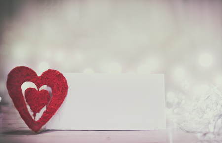 Red heart on wooden table. Romantic panoramatic banner for valetines or wedding day.の写真素材
