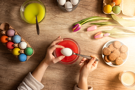 Woman preparing Easter eggs, handmade Easter eggsの写真素材