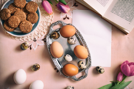 Tulips with eggs on Easter table, background, holiday, springの写真素材