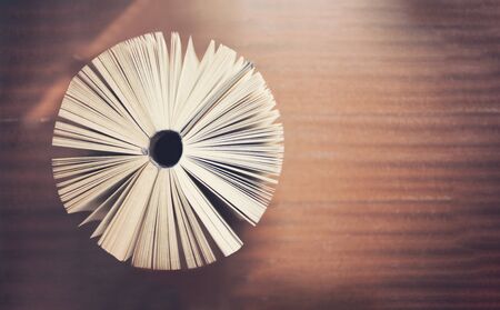 Book open in circle shape, top view