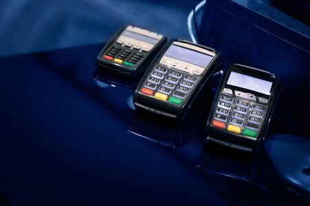 Payment terminal with tree different payment card readers. Digital Payments Methods