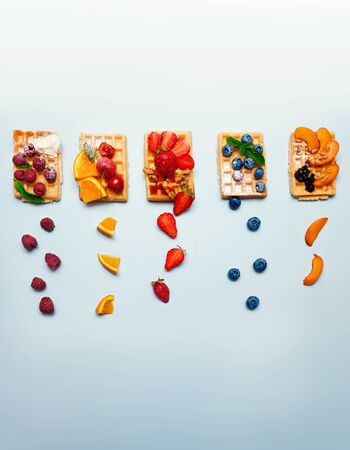 Different kind fruit cover for waffles, food background with copy spaceの写真素材