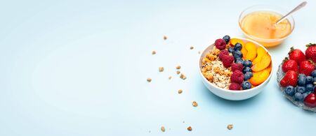 Healthy delicious breakfast, oatmeal with fruit in a bowl. Advertising background