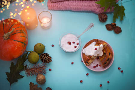 Delicious Danish pastry with yogurt topping,  autumn arrangement tableの写真素材